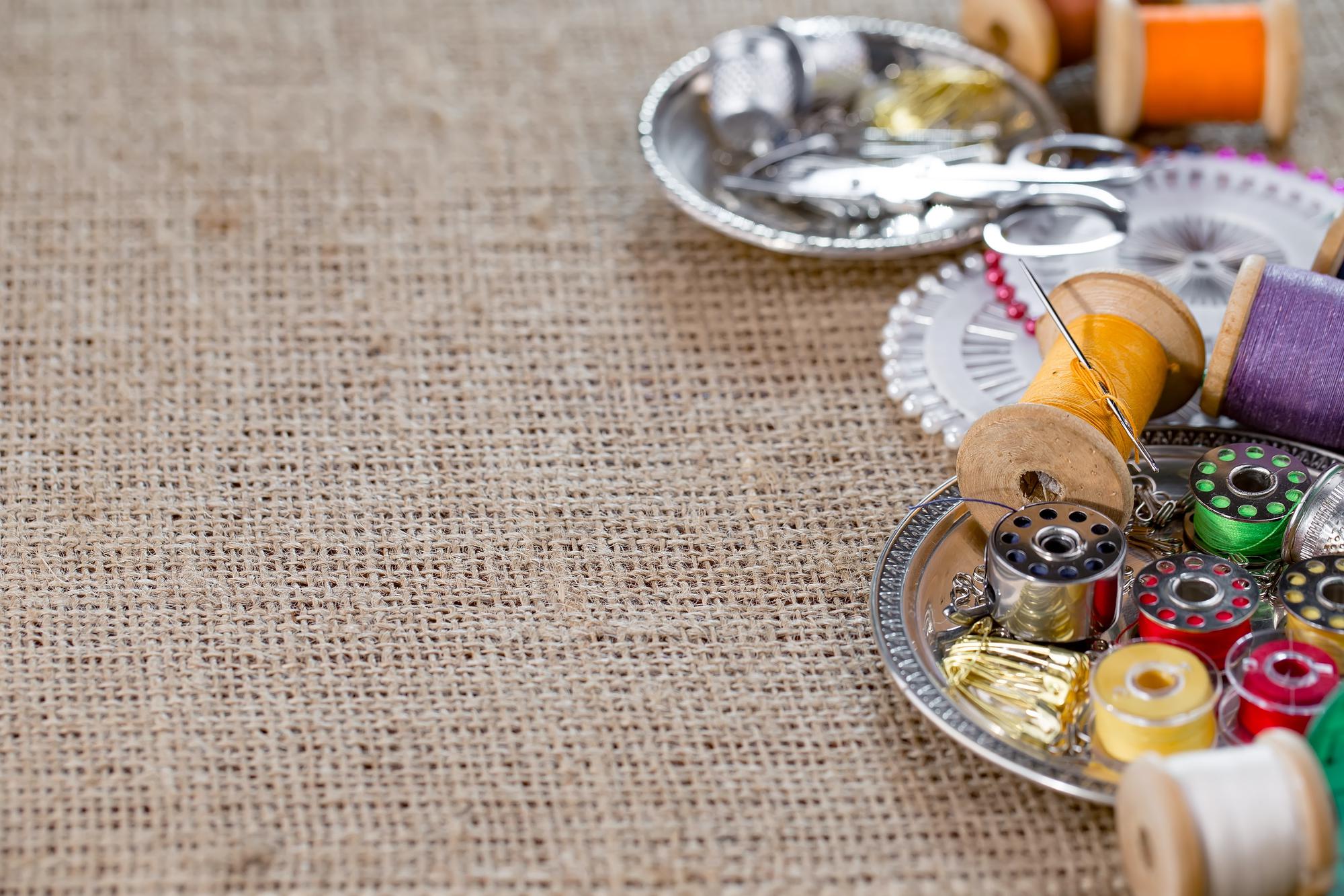 Workshop table with threads and embroidery samples