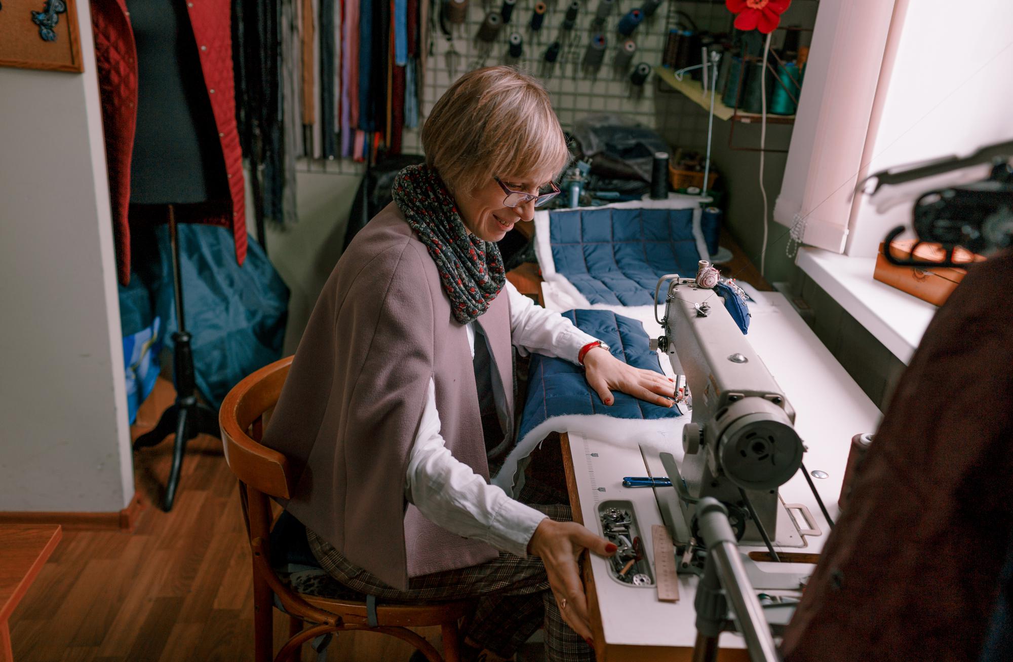 Workshop operations manager Maria arranging threads